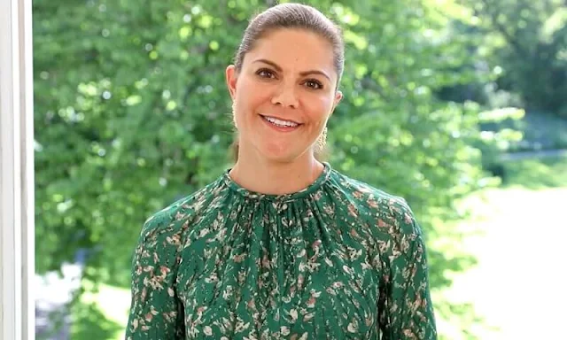 Crown Princess Victoria wore a floral dress by H&M Conscious Exclusive Collection, and rose gold poppy diamonds earrings by Kreuger