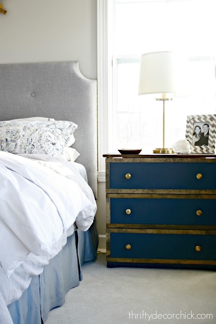 blue and wood dresser as nightstand