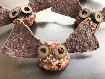 Close-up of a Halloween mini bat taco cheese ball.