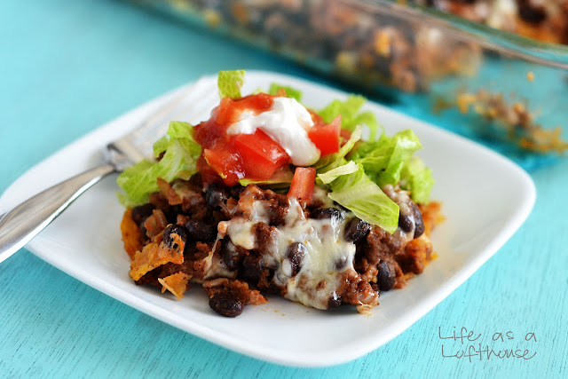 Light Taco Casserole is filled with ground beef, black beans, salsa, cheese and tortilla chips. Life-in-the-Lofthouse.com