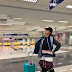 Passenger poses with a layer of clothes avoid paying excess baggage fee at airport