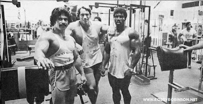 ED CORNEY, ARNOLD SCHWARZENEGGER AND ROBBY ROBINSON DURING TRAINING AND FILMING OF PUMPING IRON - GOLDS GYM VENICE, CA 1975 Robby's CONSULTATION Services to answer your questions about bodybuilding,  old schoold training and healthy lifestyle - ▶ www.robbyrobinson.net/consultation.php
