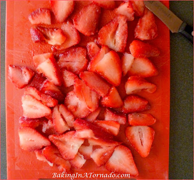 Strawberry Hot Fudge Pie, A fluffy refrigerator pie made with fresh strawberries and hot fudge sauce. Grab a plate and two forks, perfect for sharing with your valentine. | Recipe developed by www.BakingInATornado.com | #recipe #chocolate #pie #ValentinesDay