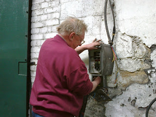 John repairing an electrical installation in Marley Hill shed