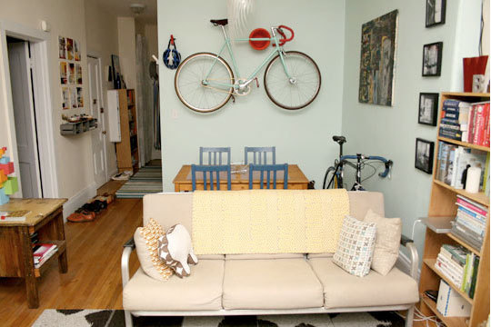 A vintage bicycle frame as art work compliments this apartment decor