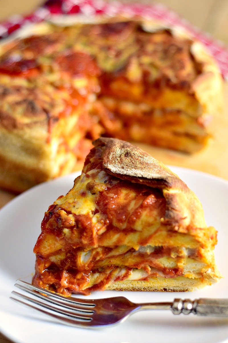 This Pizza Cake recipe uses only 3 ingredients! #ad It is easy, tasty, and sure to be a hit at your next birthday party or game day get together! @EasyHomeMeals #pizza #cake #easy #recipe #cheese #pepperoni #sausage | bobbiskozykitchen.com
