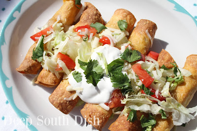 Corn tortillas, stuffed with a seasoned, cooked shredded chicken or beef, fried to crisp and garnished with lettuce, tomatoes, sour cream and fresh cilantro