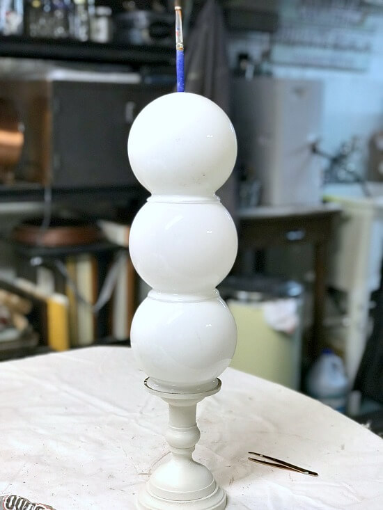 Stacked light globes for a repurposed snowman