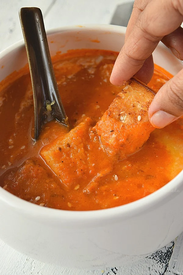 a bowl with easy homemade tomato soup with homemade croutons