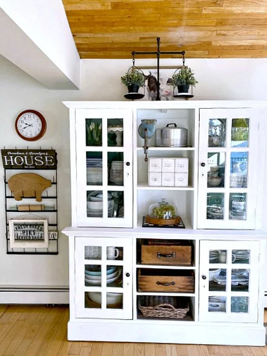 Kitchen view with large white hutch