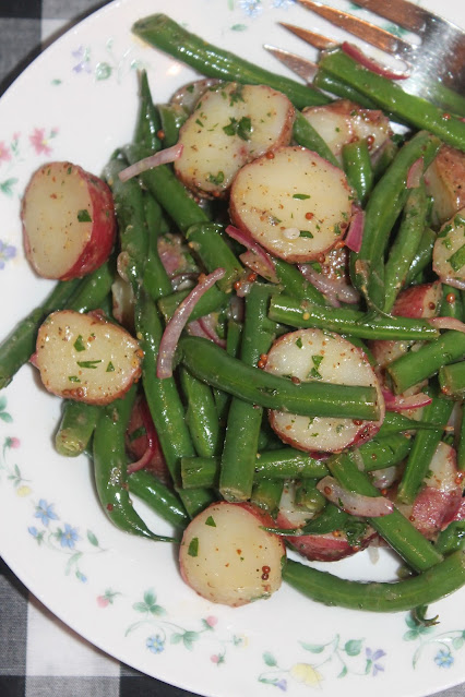 Bowl of green bean and red potato salad.