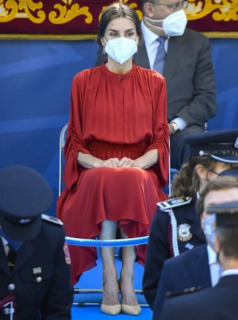 Queen Letizia of Spain wore a red long sleeve flared midi dress by Salvatore Ferragamo