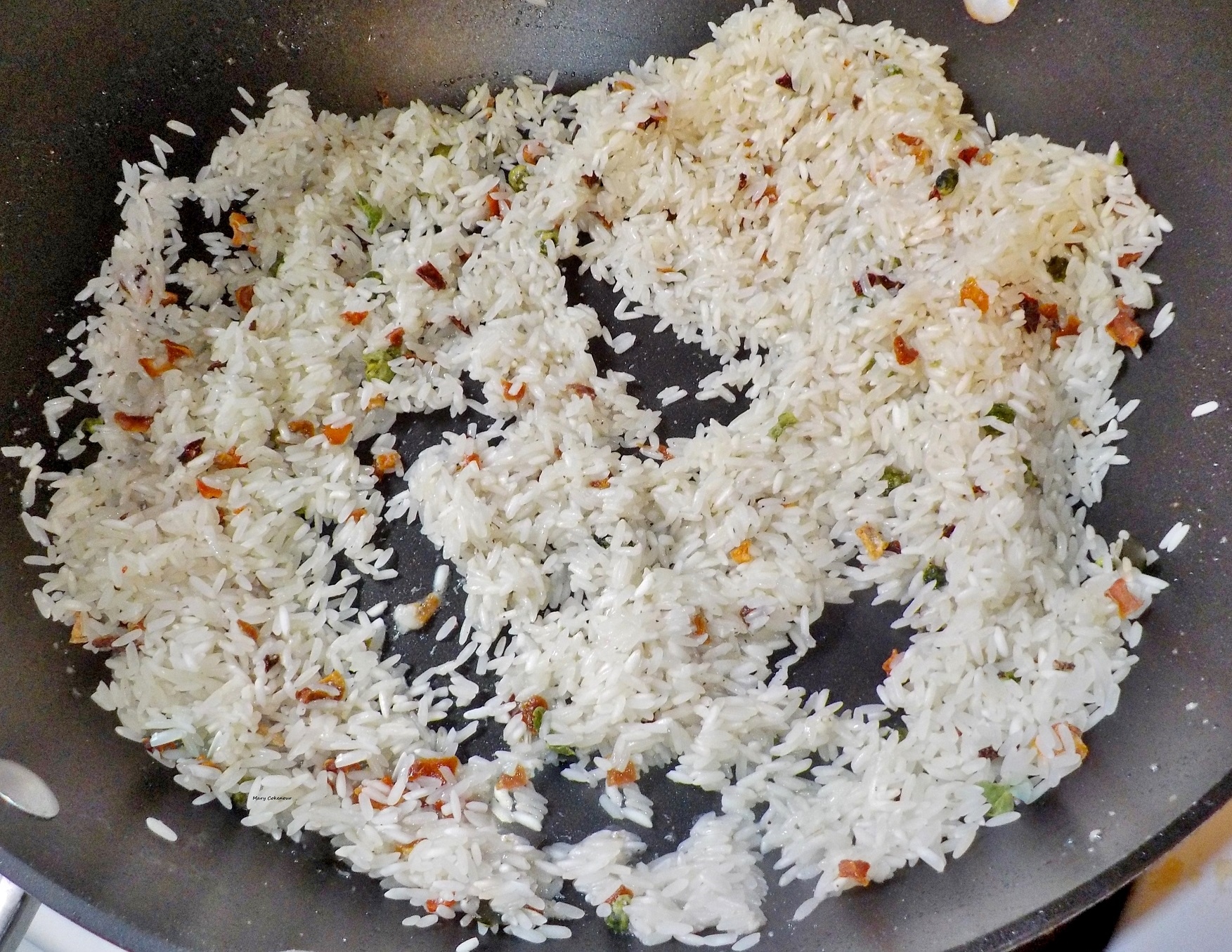 Food Adventures of a Comfort Cook Frying Up Rice in a Wok.