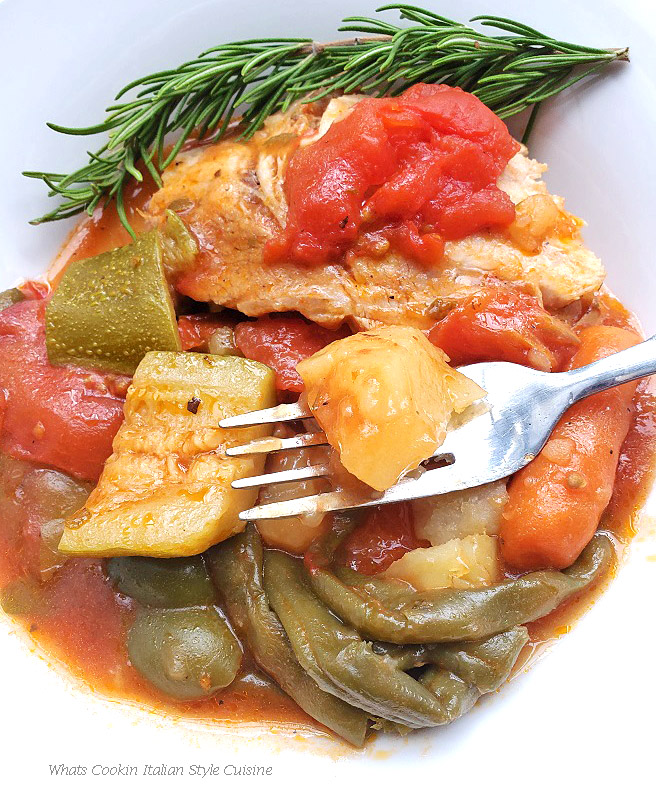 Pressure Cooker Beer Stew Roast This is a big dish of stew with fresh garden vegetables in a rich beer sauce. The plate has pork roast sliced, potatoes, zucchini, green beans, carrots, fresh plum tomatoes with a fork in there ready to eat on a white plate.