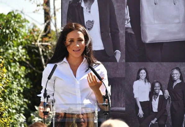 The Duchess wore a Misha Nonoo shirt, Jigsaw Paris slim tapered trousers, a Polo Ralph Lauren saddle tan nappa leather skinny belt