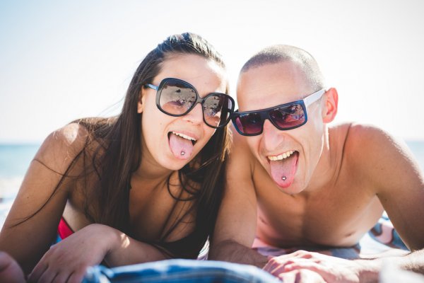couple with tongue piercing
