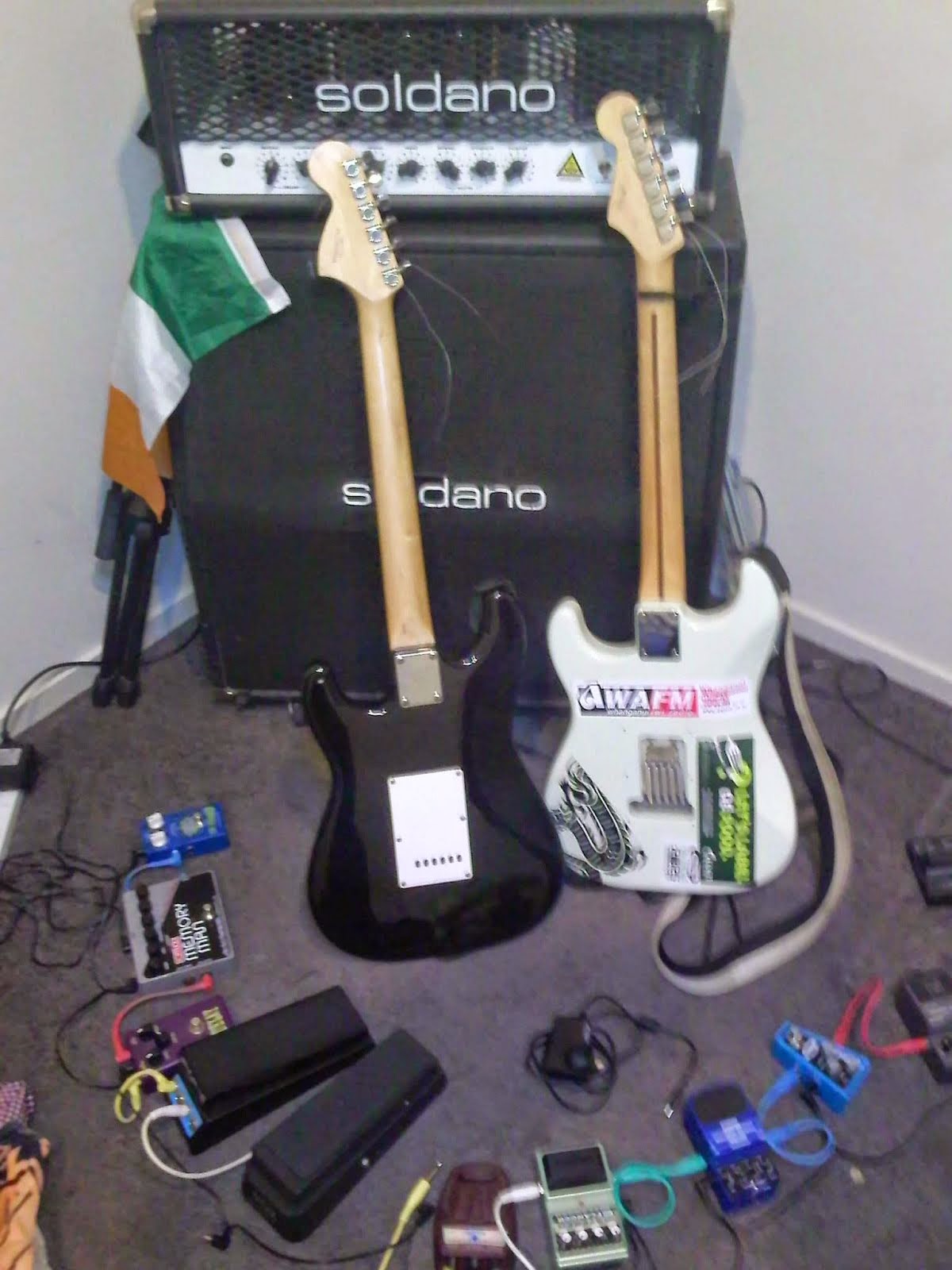 Pre bedroom jam, amplifier, speakers, guitars, and effects.