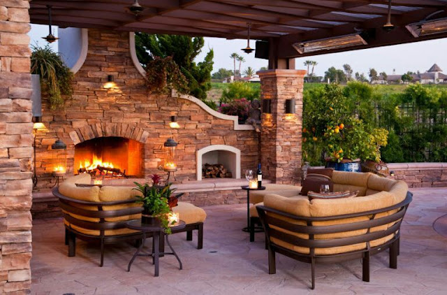 covered outdoor living spaces with fireplace