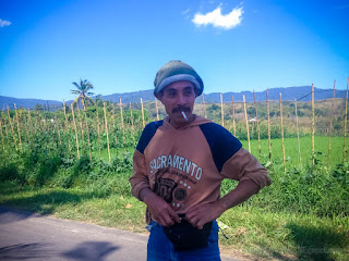 A Farmer Get Rest After Work With Cigarettes In His Mouth On The Roadside Of The Village In The Farm Area
