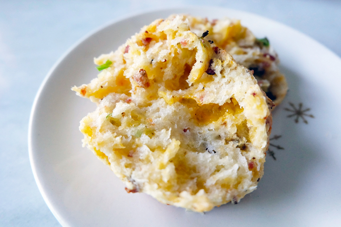 cheese buttermilk biscuit split with scallions and bacon