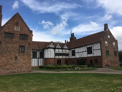 photograph of brick and half-timbered house