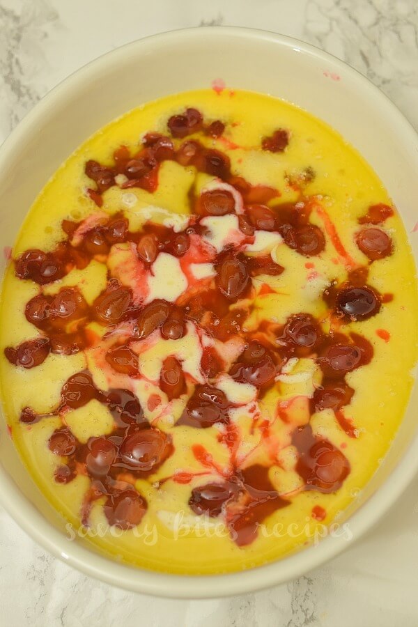 white baking dish with melted butter,added the flour mix and topped with cherry topping