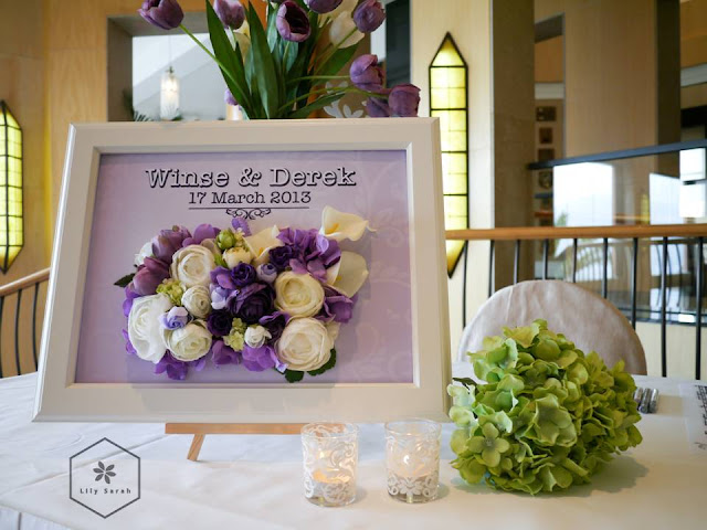 purple wedding reception decoration and welcome board