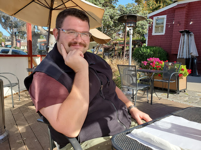 Image man at a outdoor table