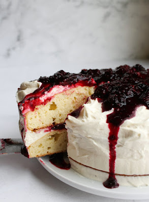 This frosting is so fluffy, creamy and delicious. It tastes a lot like whipped cream and that's what it was called when I was introduced to it. Now I know that it's also called Ermine or Boiled-Milk Frosting. No matter what you call it, it's good! blackberry shortcake cake frosted with ermine frosting and topped with blackberry sauce