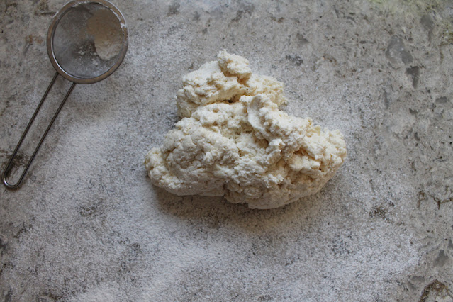 The dough ready to knead on a well floured surface.