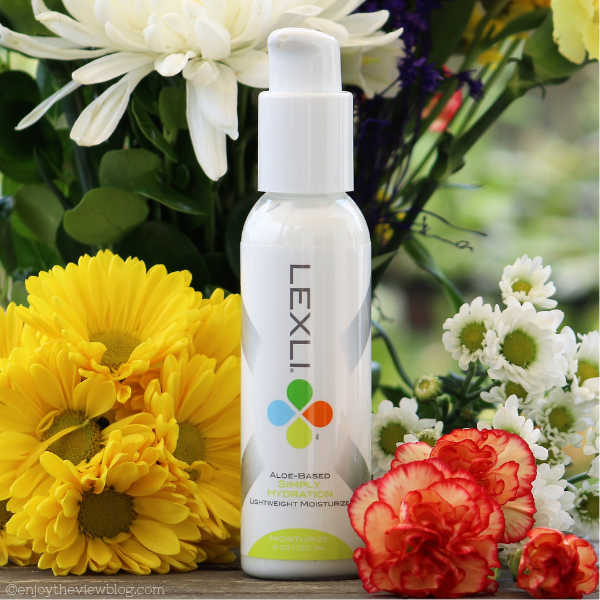 Lexli's Simply Hydration is a lightweight moisturizer with an aloe vera base suitable for all skin types, but especially for sensitive skin/ #sponsored #skincare #beauty #rosacea #sensitiveskin #aloevera #lexli #over50 #enjoytheviewblog bottle of lotion sitting in front of yellow and orange flowers