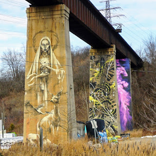 Murals painted on the train bridges along Bayview Ave, near Brickworks.