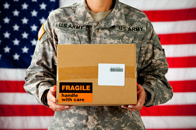 Soldier holding a care package
