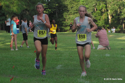Swift Creek athletes #897 Paige Churchill (1st, 13:12) and #898 Lexi Gray (2nd, 13:15) leading the girls' two-mile race with about a kilometer to go. Paige Churchill, Lexi Gray