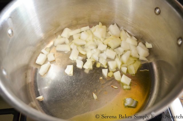 Sautéed onion in a soup pot for Creamy Tomato Tortellini Soup recipe.