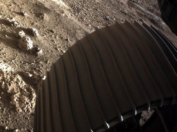 A close-up of one of Perseverance's six large wheels...as seen by one of its Hazard Cameras on February 18, 2021. A close-up of one of Perseverance's six large wheels...as seen by one of its Hazard Cameras on February 18, 2021.