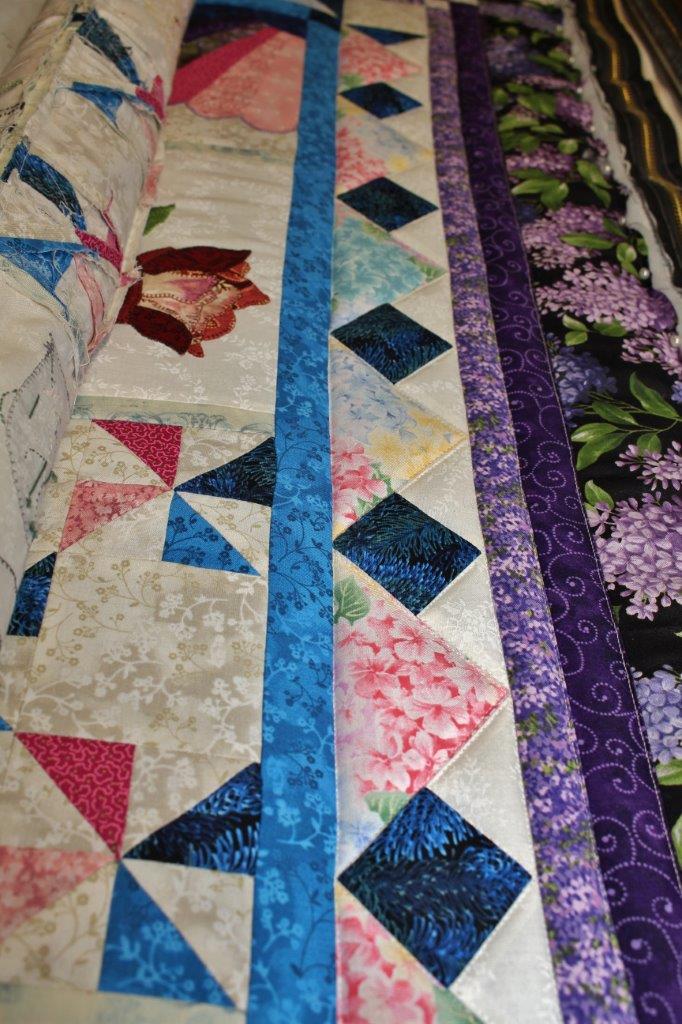 Sarah Lynn's Quilting Stitching in the Ditch on the Buoyant Blossoms Quilt