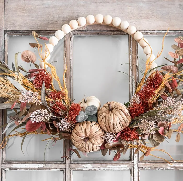 beaded Fall wreath with woven pumpkins