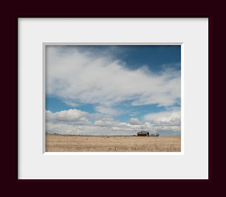 A solitary home is dwarfed by the vast space of the western prairie in the US.
