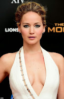 Inspiring! Jennifer Lawrence is all smiles as she arrived the Hunger Games after party in a magnificent long white gown.