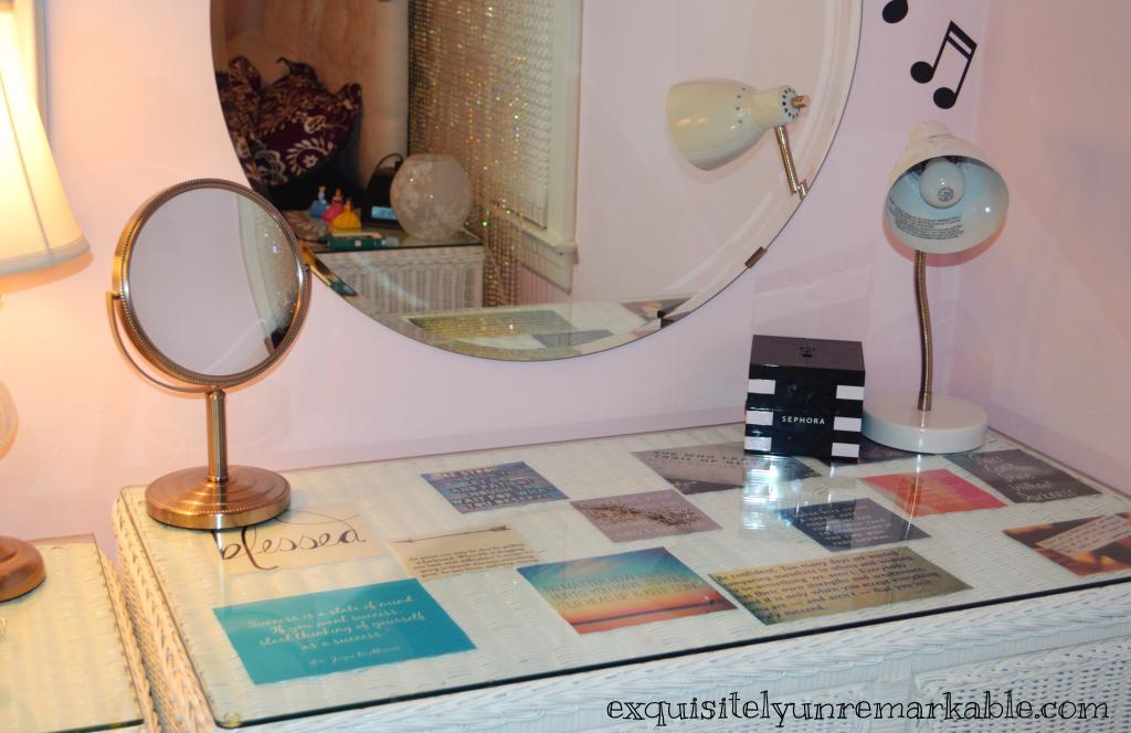 Teen girl's desk with glass over cut out quotes