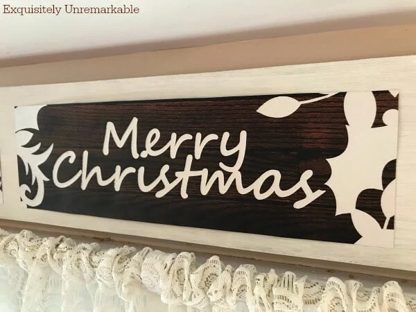 Merry Christmas Gift Bag Sign Over A Window