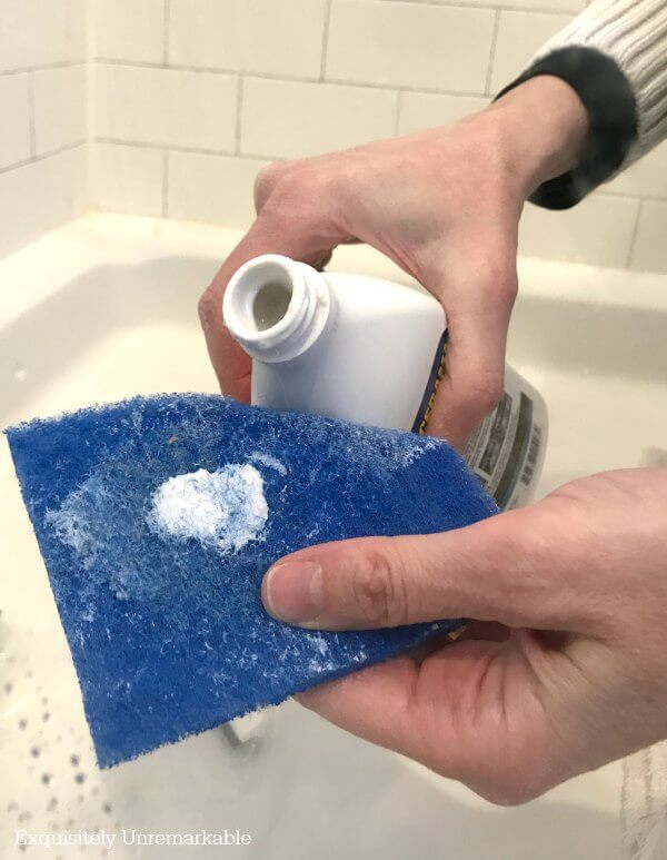 Glass Shower Door Cleaner cerama bryte cleaner on a blue scotch brite pad