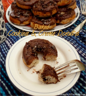 Baked Cookies and Crème Donuts are light and fluffy donuts studded with chunks of cookies and topped with a sweet chocolate glaze. | Recipe developed by www.BakingInATornado.com | #recipe #chocolate