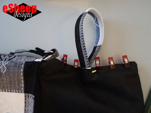 Adding a water bottle support strap to bag interior