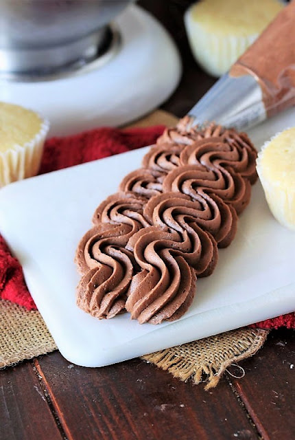 Chocolate Cream Cheese Frosting Piped on Cutting Board Image