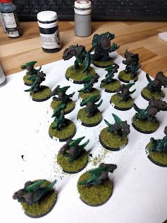Even with the flock the bases look a little amateur. Flocked bases, waiting to dry before brushing off the excess