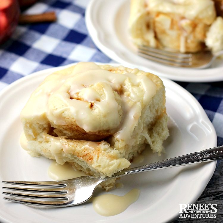 Apple Cinnamon Rolls with Maple Glaze by Renee's Kitchen Adventures on white plates and ready to eat with forks
