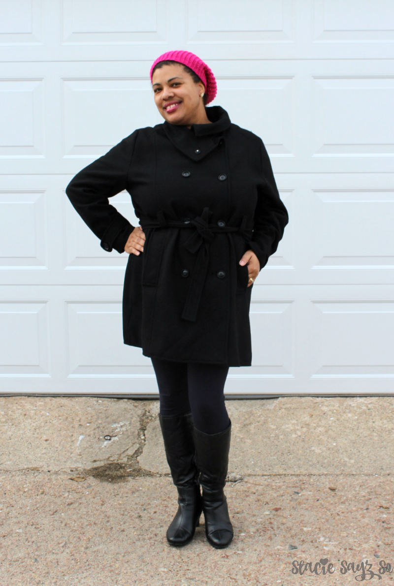 a woman in a black wool coat