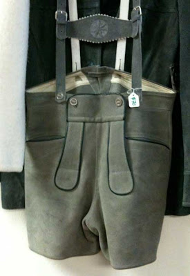 Gray suede lederhosen hanging on a hanger